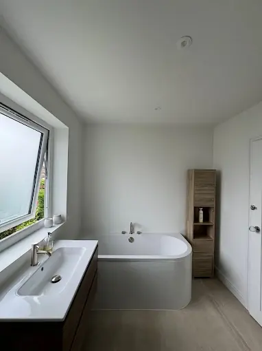 A bathroom repainted in a clean, moisture-resistant finish.